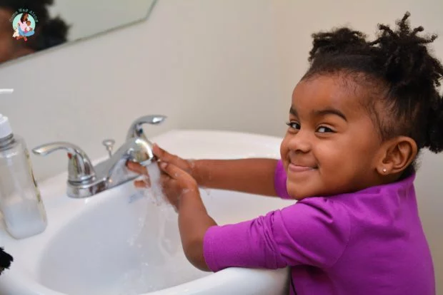 Toddler Washing Hands - Showing Independence Milestone